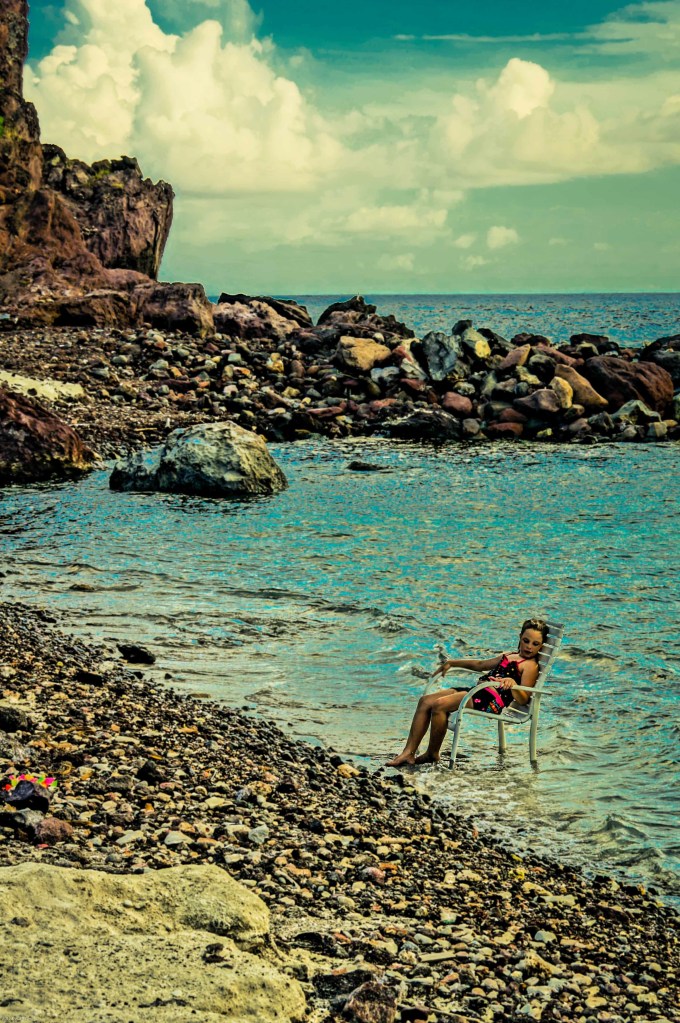 Girl Reclining At Cove Bay Beach, Saba, Dutch Caribbean
