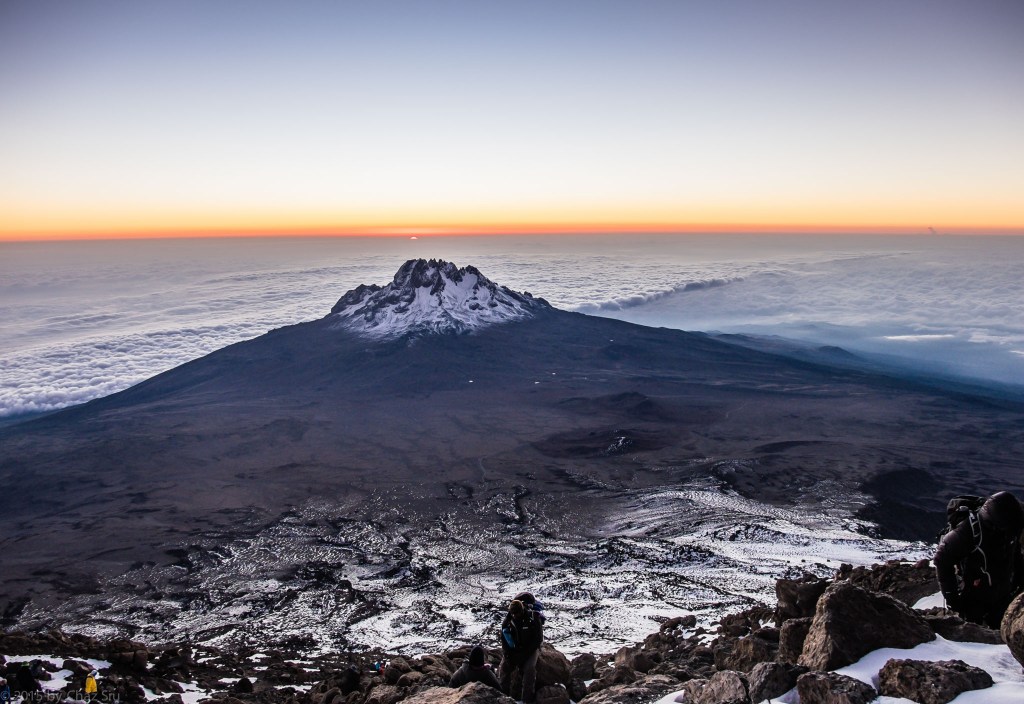 The Earth is Curved..6:30am Crater Rim Sunrise With Mawenzi and Clouds Below Us 