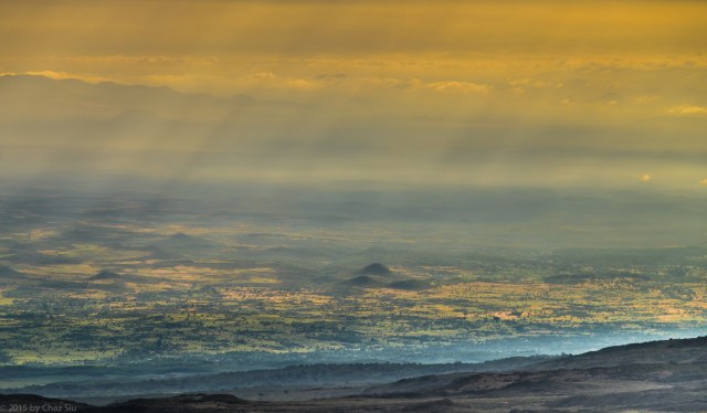 Sunbeams Pierce The Kenyan Plains Below Buffalo Camp