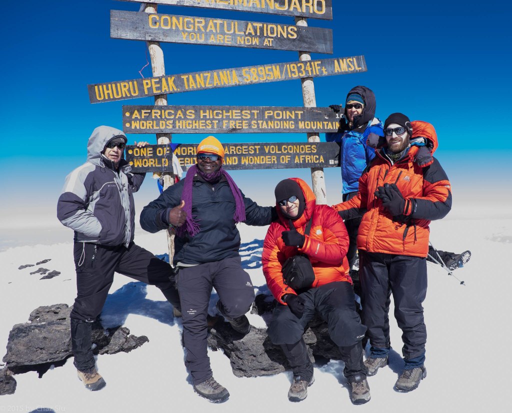 Uhuru Peak Summit - The Roof Of Africa. L to R, Alex, JT, me, Caryl, Paul. Rhys, Cort, and Kitt had summited an hour a head of us. 